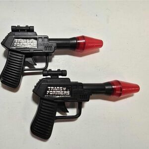Lot of 2 vintage Transformers Guns 1984